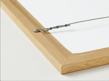 Detail of a corner of the wooden frame with a strong cord